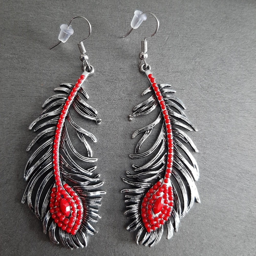 Red tail feather tribal earrings